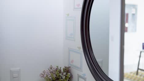 sink in the bathroom with plant and mirror