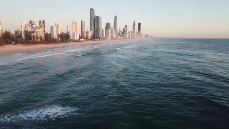 Drone-shot-of-stand-up-paddle-boarder-on-ocean-during-sunrise-in-the-Gold-Coast