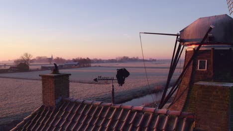 Aerial-view-of-small-wind-vane-on-small-house-wind-windmill-at-Holland