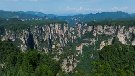 panoramic drone shot circling a karst mountain landscape in zhangjiajie, china