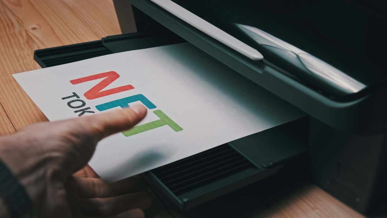 NFT Token Printing, Inscription on White Sheet of Paper Printed by a Jet Printer