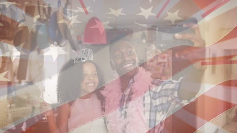animación de la bandera de los estados unidos de américa sobre un padre y una hija afroamericanos divirtiéndose