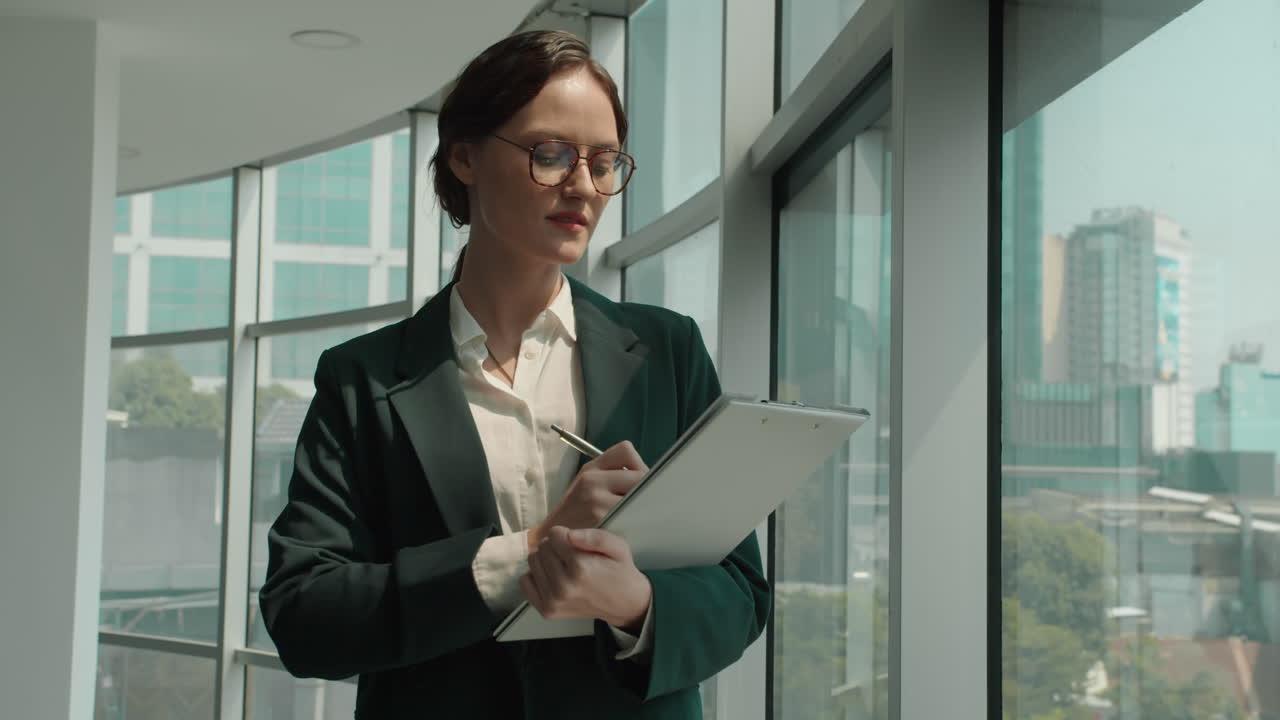 Portrait of Caucasian Businesswoman Filling Form in Folder