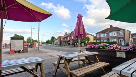 colorful umbrellas and tables in a street setting