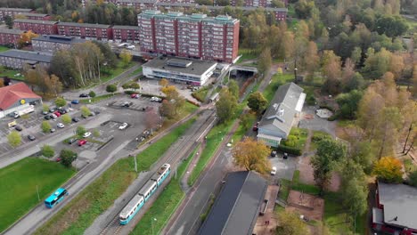 aerial, tram arriving at station in gardsas torg