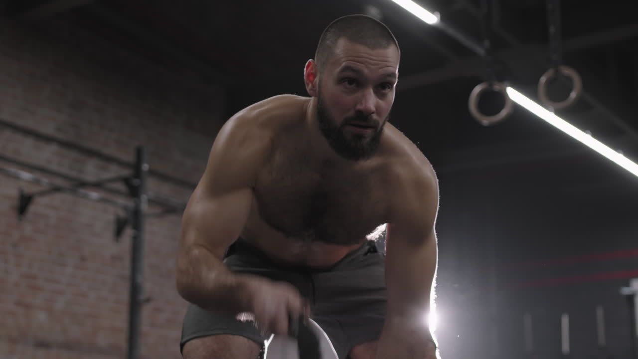 Man Doing Exercise with Battle Ropes