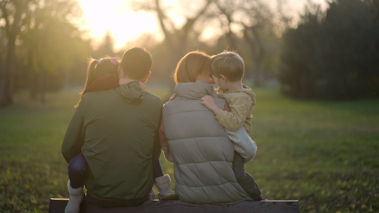 Family Enjoying Sunset in Park
