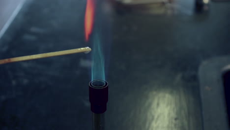 Close-up-of-attempted-flame-test-of-clacium-ions-with-too-much-water-on-the-splint