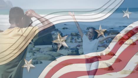 Animation-of-american-flag-over-african-american-couple-taking-photo-at-beach