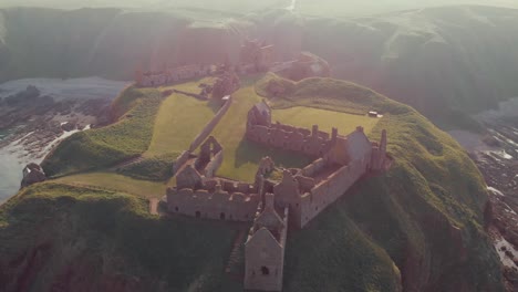 dunnottar castle with clear sky in stonehaven, aberdeen, scotland, uk in sunset