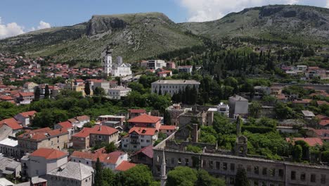 The image of the city&#039;s stone houses and the harmony of the historical Mostar bridge with the urban texture