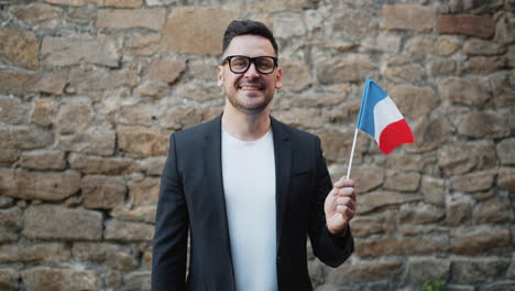 man holding french flag