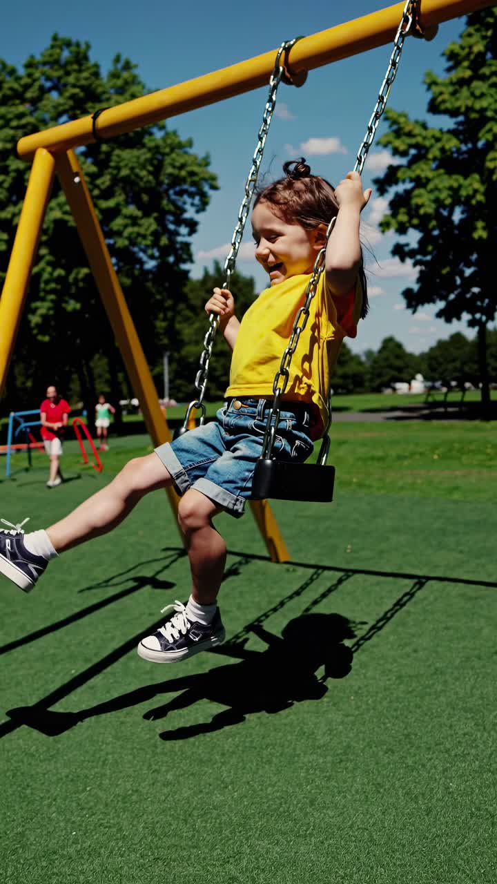 A child swings joyfully in a park, captured from a low angle