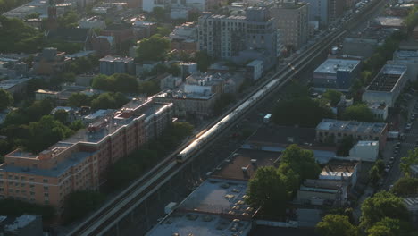 aerial view of the long island railroad at sunrise. shot in brooklyn on a summer morning