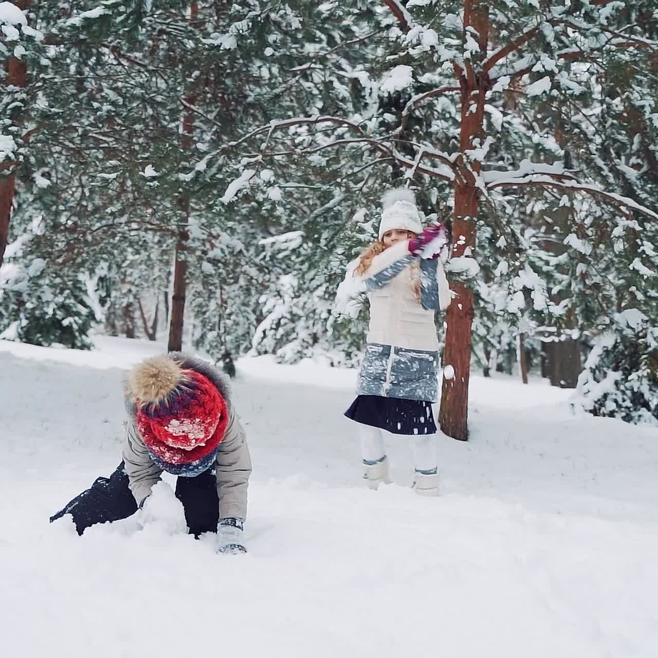 Children play outdoors in snow