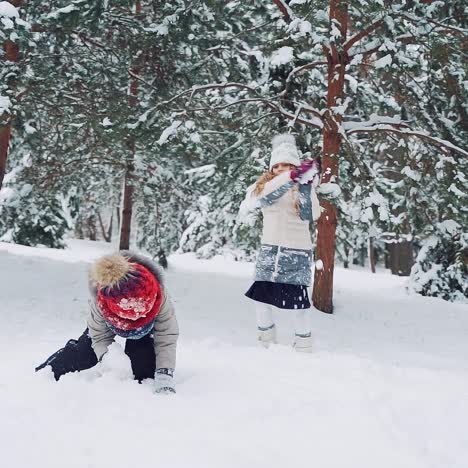 children play outdoors in snow