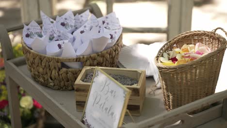 wedding petal station with cones lavender and colorful rose petals