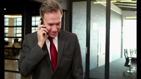 smiling businessman on phone call