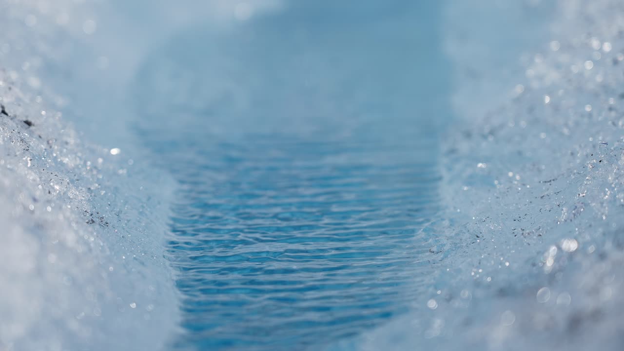 Meltwater stream on glacier in Norway, macro shot with dreamy natural feeling