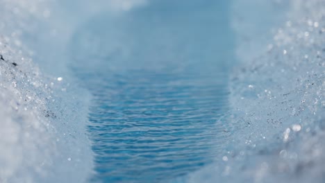 meltwater stream on glacier in norway, macro shot with dreamy natural feeling