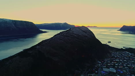 Picturesque-of-Alesund-town-in-Norway-surrounded-by-cliffs-and-seascape-during-golden-hour