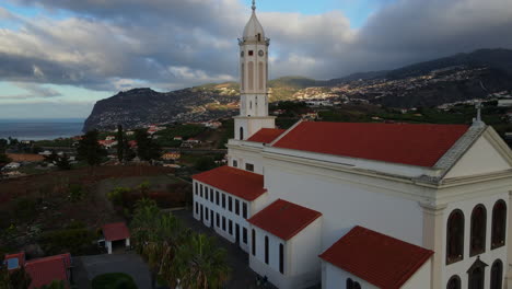 Sao-Martinho-church-in-Madeira:-aerial-lateral-movement-over-the-beautiful-church-during-sunset