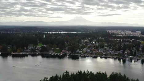 mount rainier volcano and national park from american lake in washington, usa