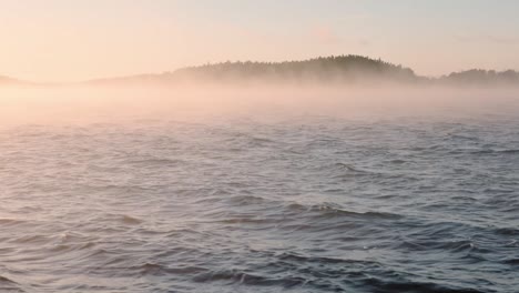 windy and misty sea during sunset golden hour in southwest finland in autumn