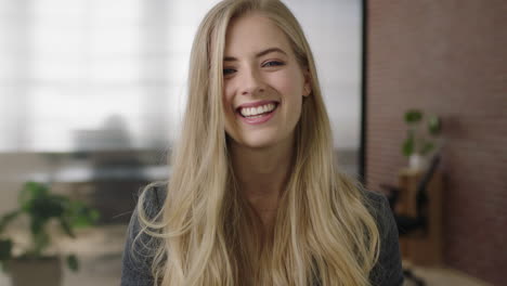 close up portrait of attractive young blonde woman executive smiling cheerful enjoying start up business opportunity