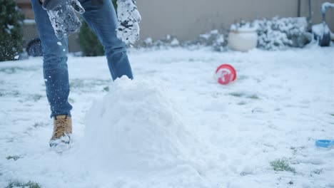 grandfather and granddaughter having fun in the snow