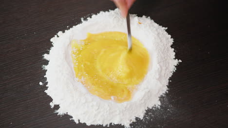 preparation of egg and flour dough for a typical calabrese dessert