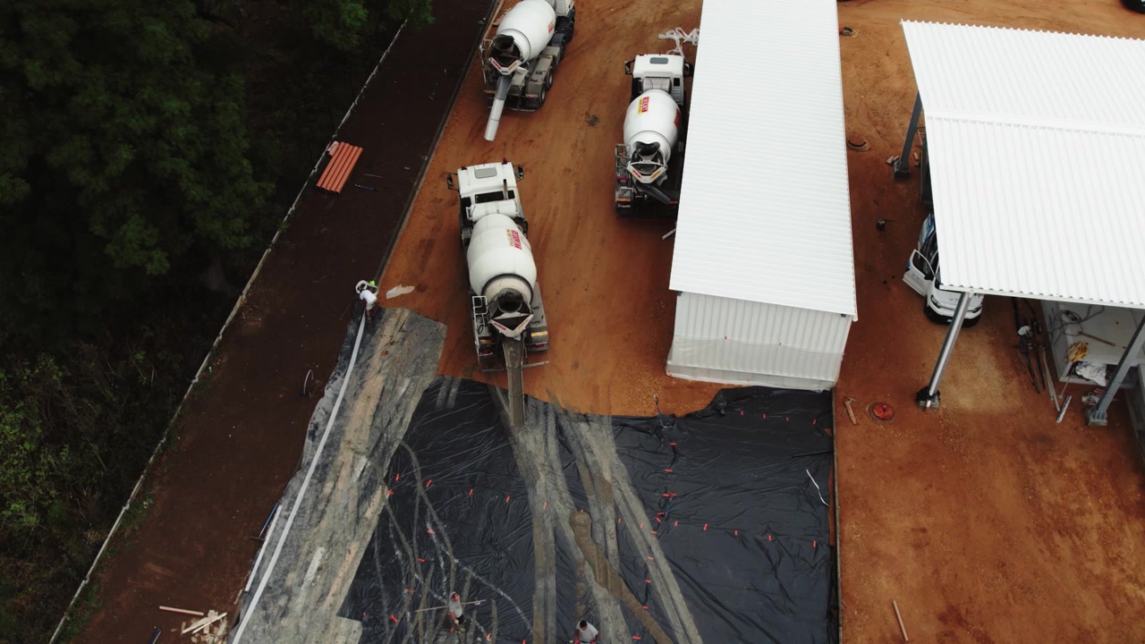 Concrete Pump Trucks on Construction Site, Aerial 4k
