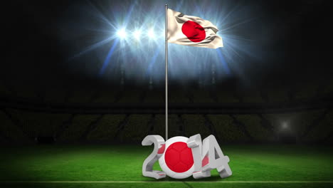 japan national flag waving on football pitch with message