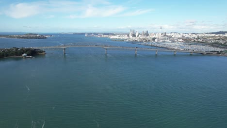 aerial view of auckland harbour bridge and city skyline