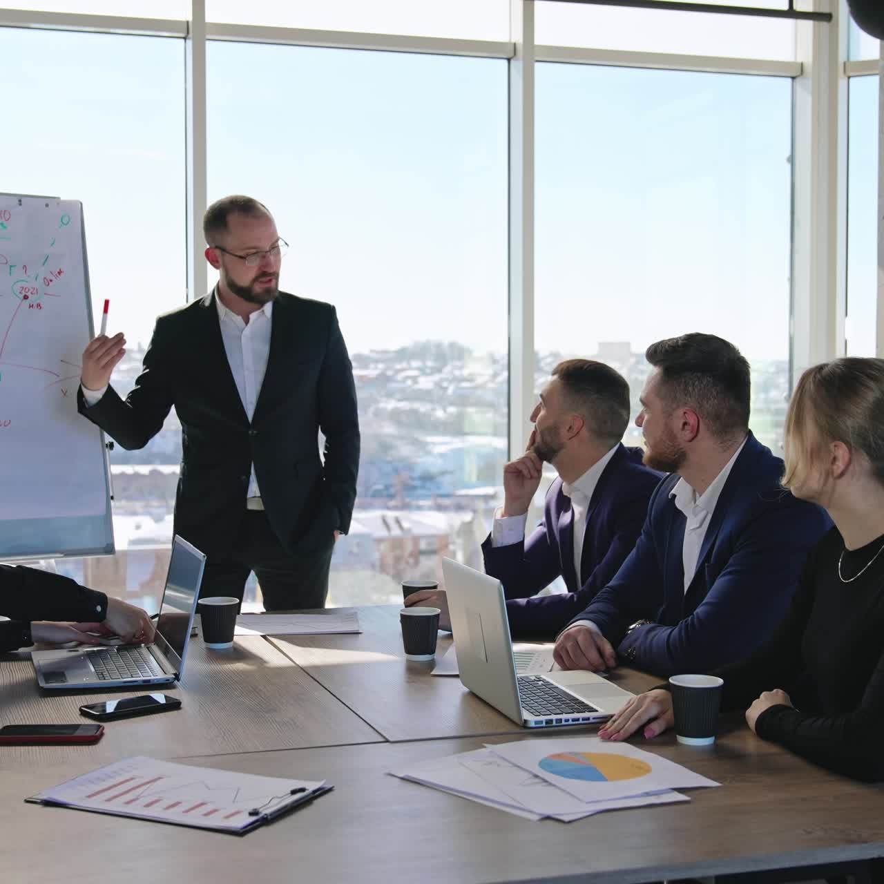 Business team discussing business project. Briefing for the office workers at the table in a spacious office