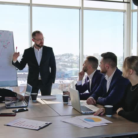 business team discussing business project. briefing for the office workers at the table in a spacious office