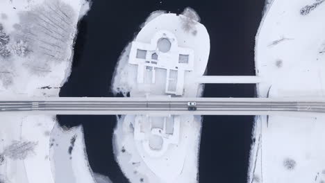 overhead aerial view above the kajaani castle and traffic, winter day in finland