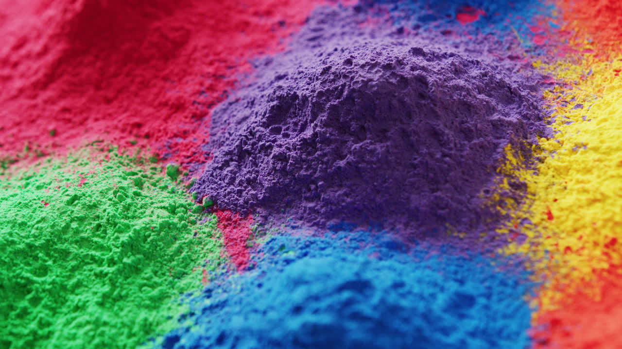 Video of close up of multi coloured powders with copy space