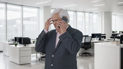 angry indian senior manager shouting on phone