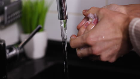 person washing hands