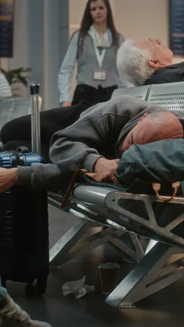 people sleeping in airport waiting area