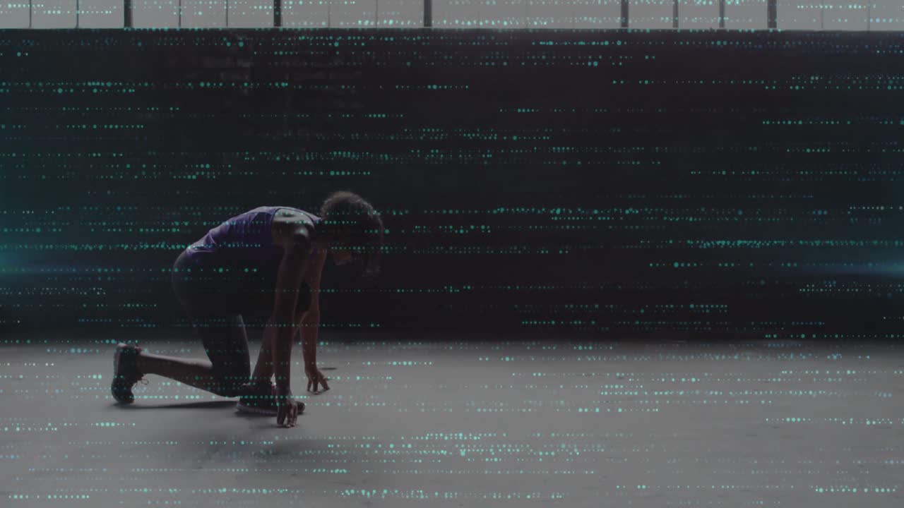 Athlete shifting weight on floor, creating teal particles forming grid overlay for fitness analysis