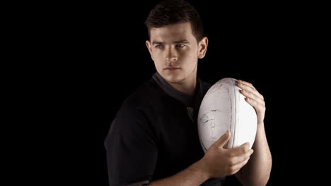 serious rugby player with ball