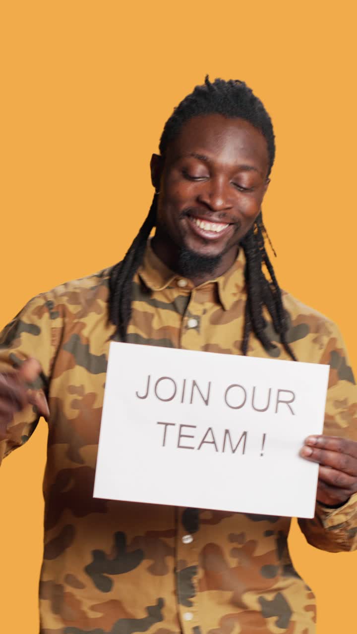 Vertical Video African american job recruiter showing papers for workforce