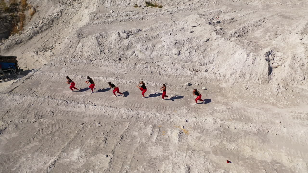 Group of Women Dancing in a Quarry