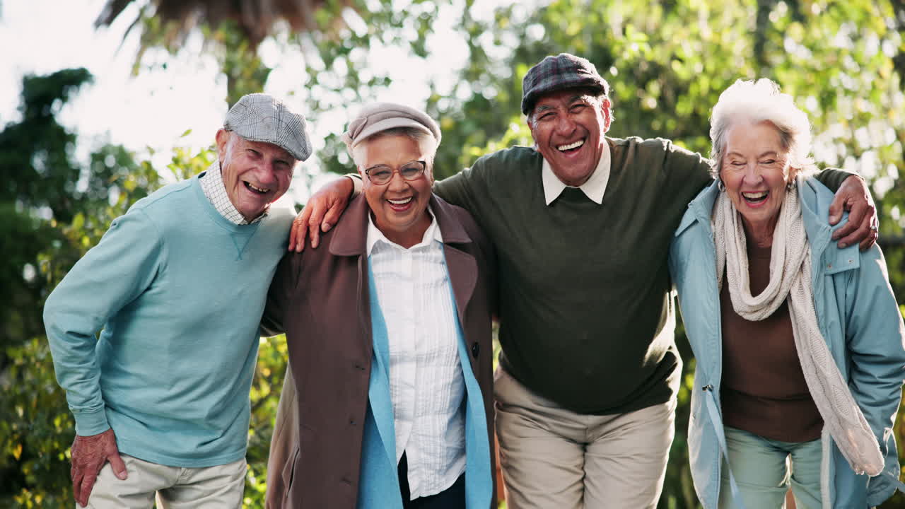 Group of elderly friends laughing outdoors