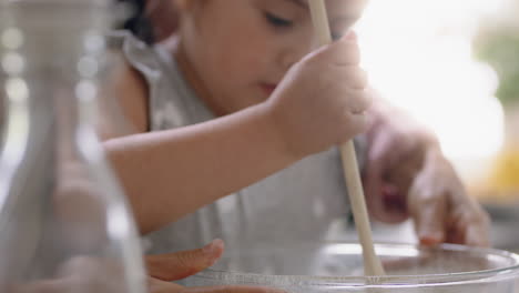 little-girl-helping-mother-bake-in-kitchen-mixing-ingredients-baking-cookies-preparing-recipe-at-home-with-mom-teaching-her-daughter-on-weekend