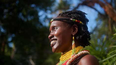 elegant jewelry gracing a woman from the karamojong tribe in uganda, east africa - close up