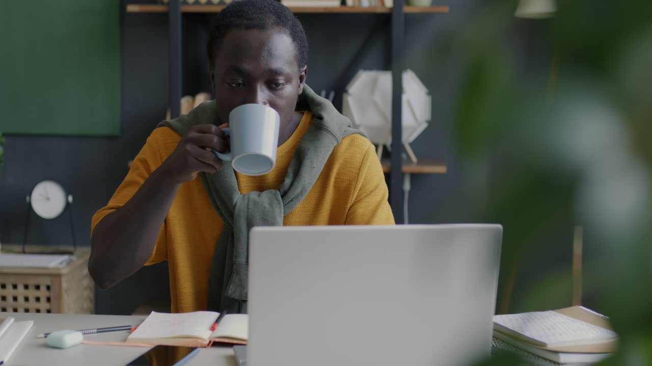 Man Working on Laptop in Home Office