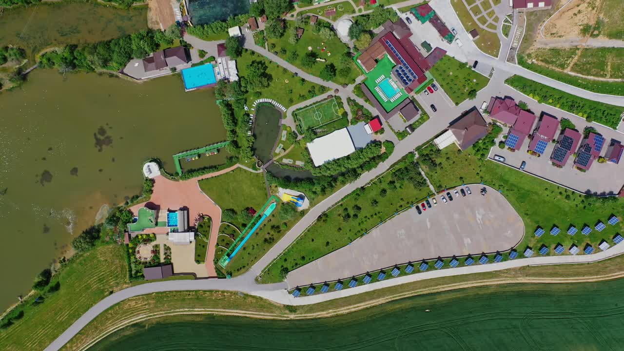 Resort complex for leisure activity. Modern recreation center with health attractions on nature background. Top aerial view.